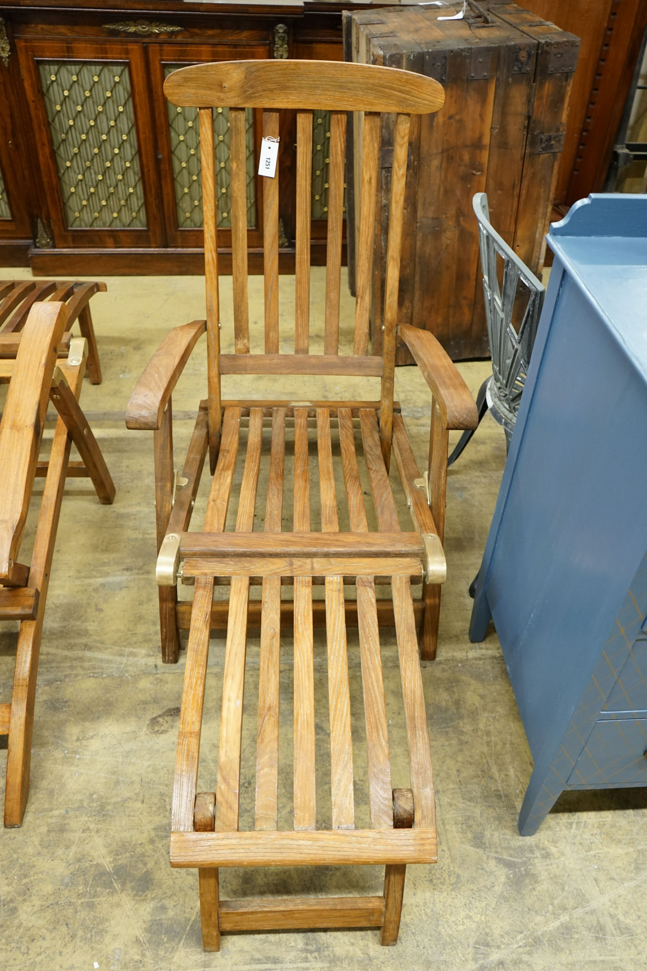 A teak brass mounted garden steamer chair, labelled Barlow Tyrie